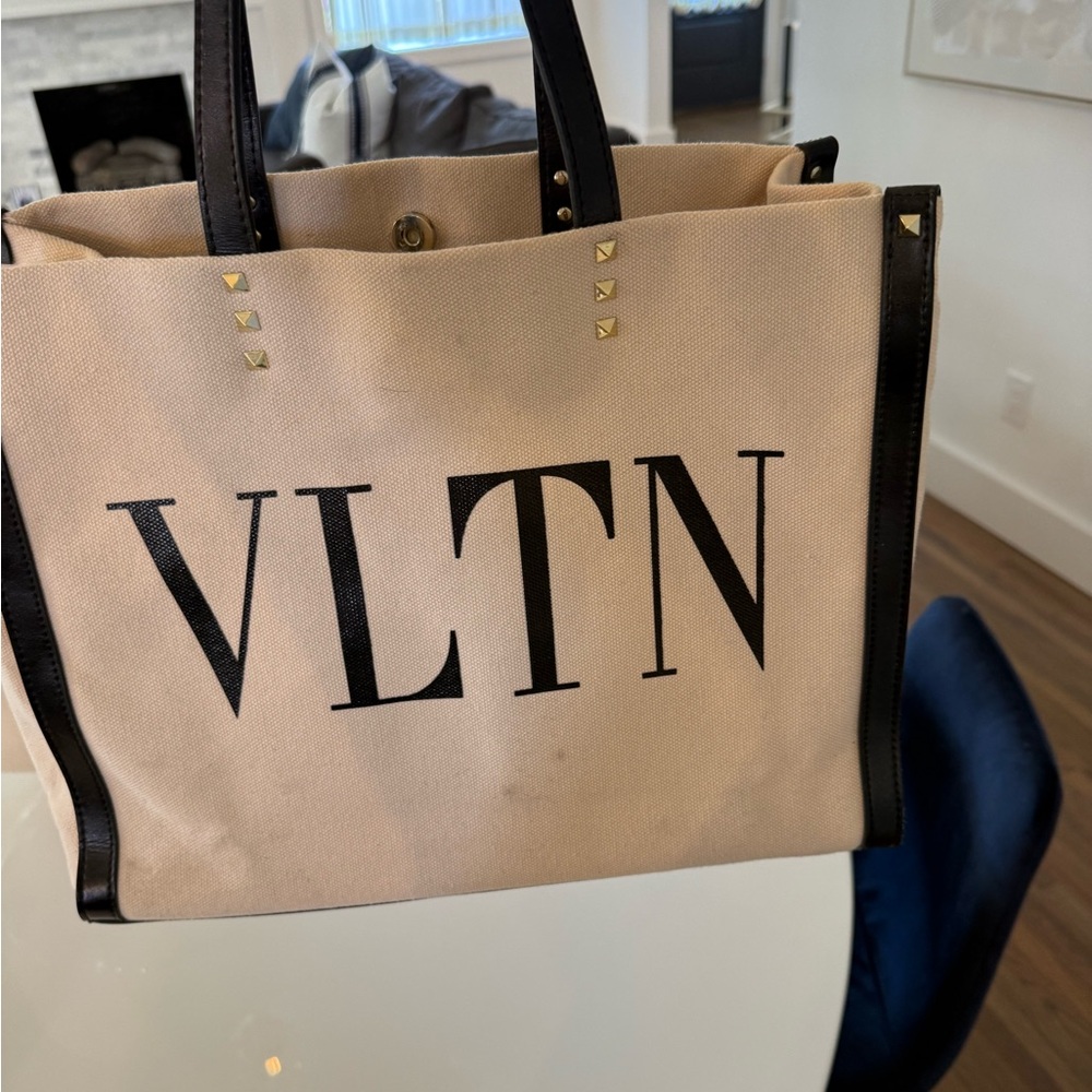 Beige Canvas Tote with Black Trim and Stud Accents